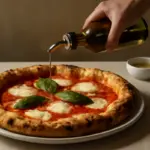Quando aggiungere olio sulla pizza? Il momento ideale per esaltare aroma e croccantezza